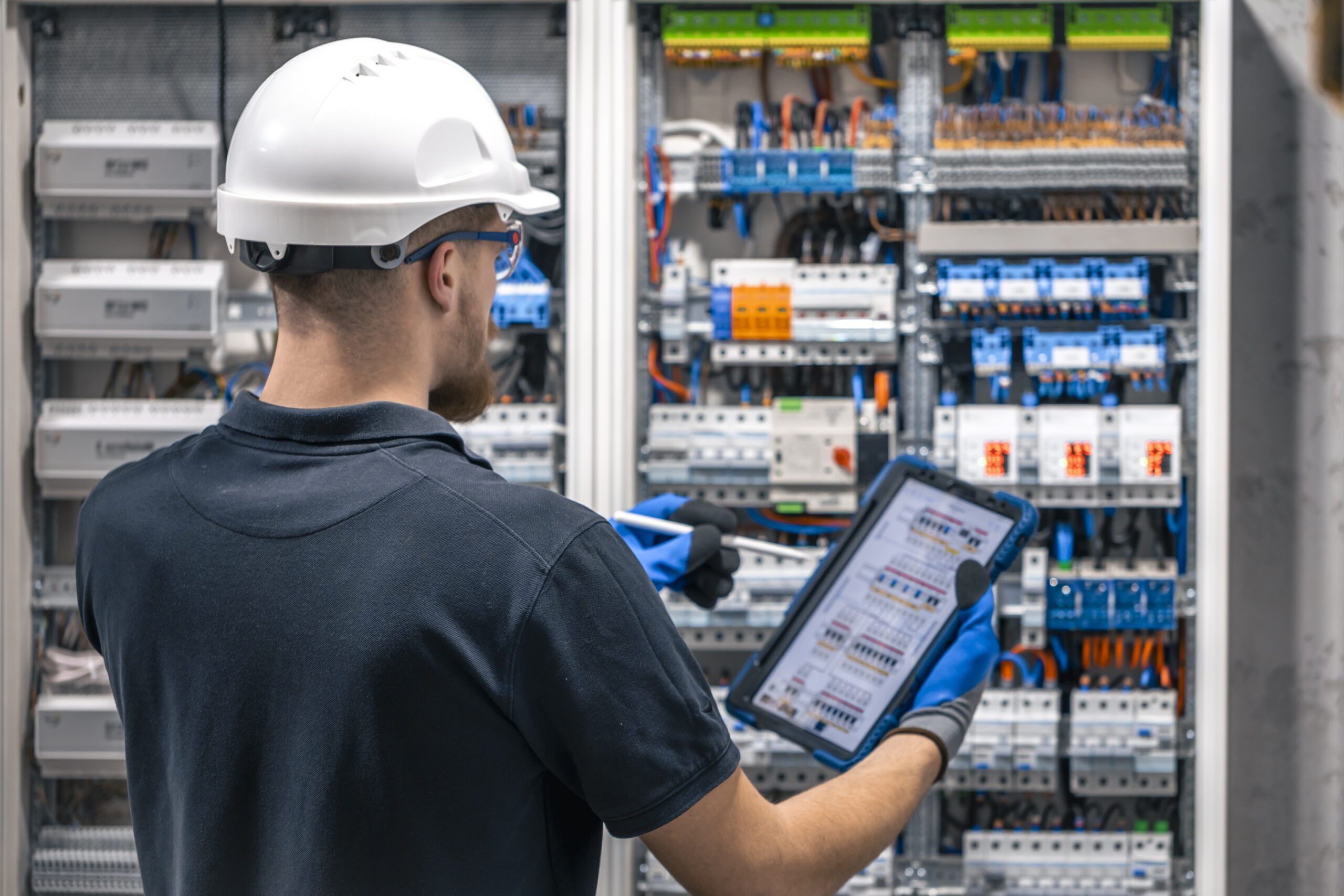 Professional electrical estimator examining and analyzing